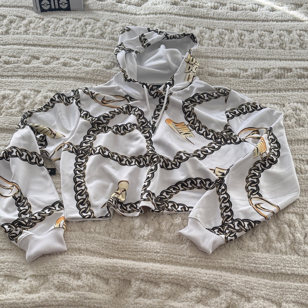 Nike White Hoodie with Black and Gold Chain Design
